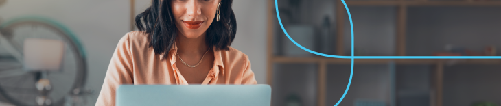 professional woman reviewing her CV on a laptop in a modern home office – concept of optimizing a medical CV for ATS (applicant tracking systems)