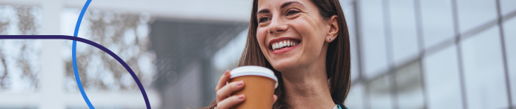 smiling CRNA enjoying a coffee break outdoors in scrubs, representing work-life balance for nurse anesthetists