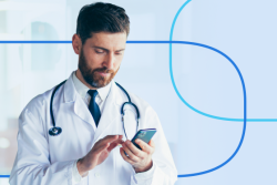 Doctor in a white coat with a stethoscope around his neck using a smartphone