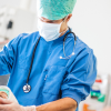 Certified Registered Nurse Anesthetist administering anesthesia during surgery – how to become a CRNA guide