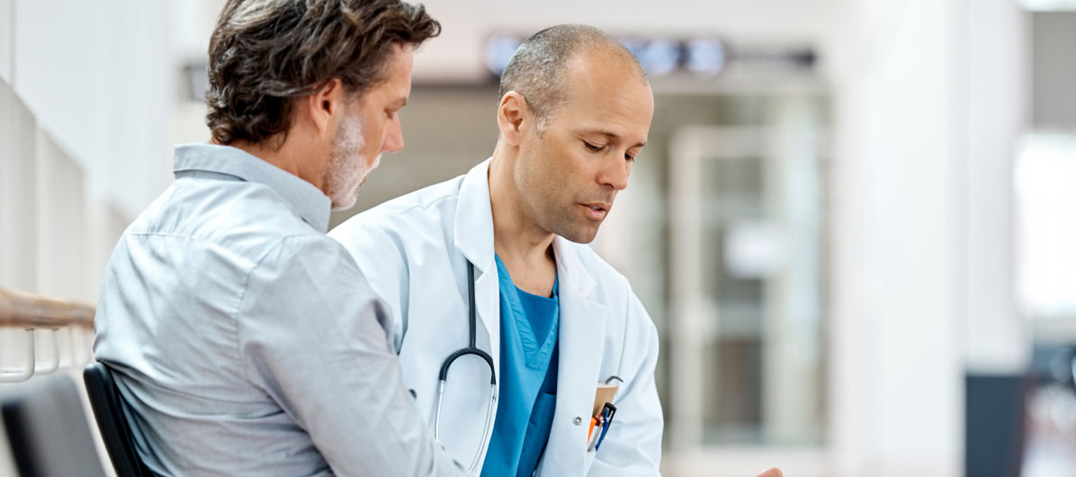 Male doctor with patient